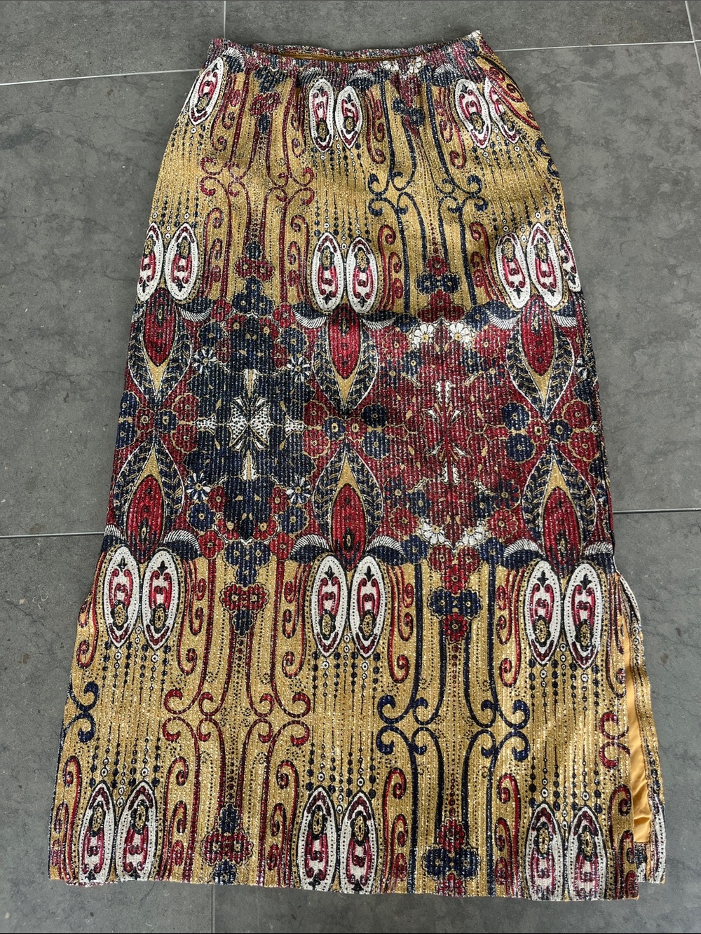 Vintage Gold lurex tribal print skirt w/side slits and elastic waist.  Size 10